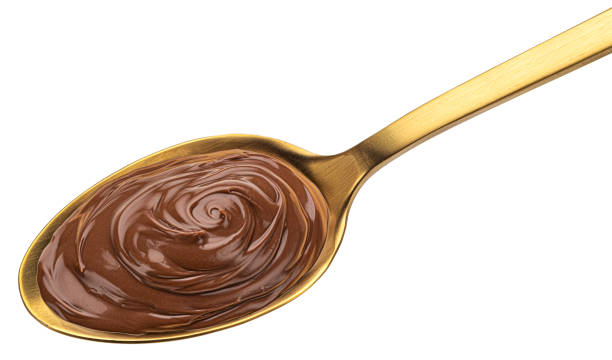istock Hazelnut cream in spoon isolated on white background 1406749680