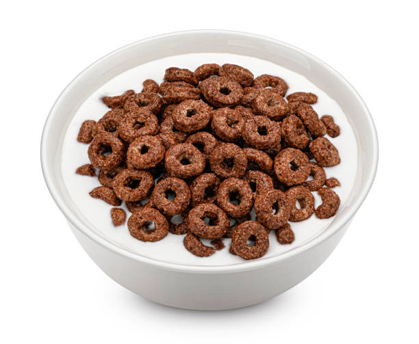 istock Chocolate corn rings with milk isolated on white background, top view 1406749712