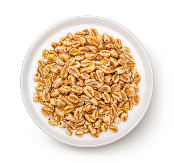 istock Puffed wheat cereal isolated on white, top view 1406749745
