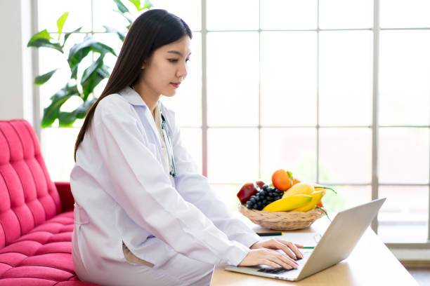 istock Female doctor using laptop. 1406749781