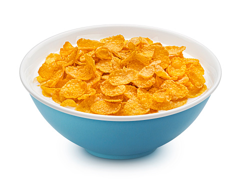 Original corn flakes with milk isolated on white background, full depth of field