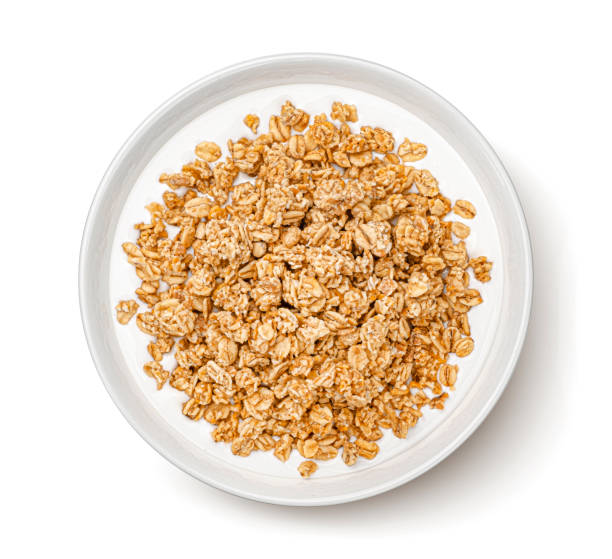 Oat granola with milk isolated on white background, top view