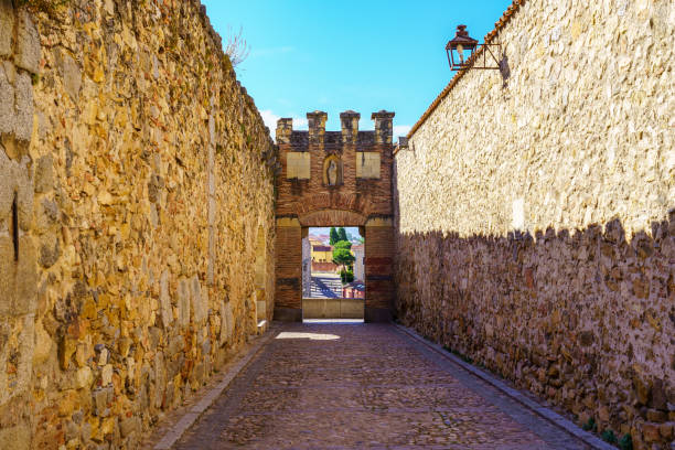 istock Wall attached to the aqueduct of Segovia with arched access doors, Spain. 1406750080