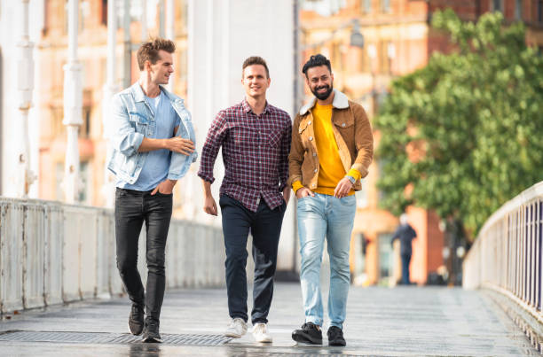 istock Friends crossing a bridge together 1406750154