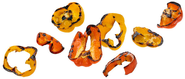 istock Grilled paprika slices isolated on white background 1406750468
