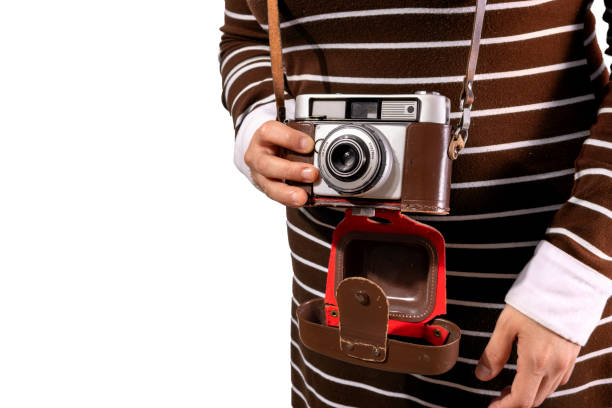 istock retro camera used by young woman 1406757990