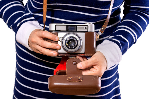 retro camera used by young woman