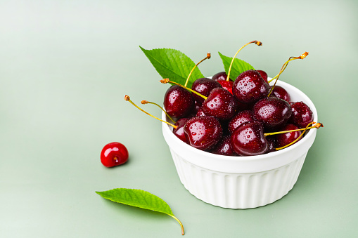 sweet cherries on wooden table