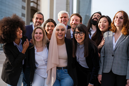 Diverse business team posing together enjoying