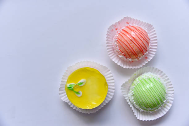 Overhead shot of sugar sprinkles on pink color background