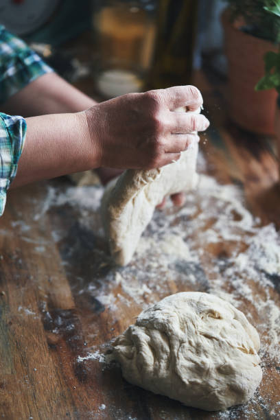 istock Preparing Focaccia Bread in Domestic Kitchen 1406763985