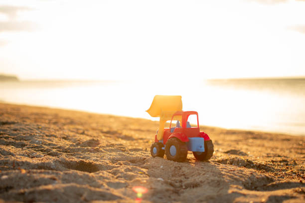 istock Excavation vehicle toy in the beach. 1406766320