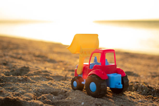 istock Toy vehicle in the beach. 1406766322
