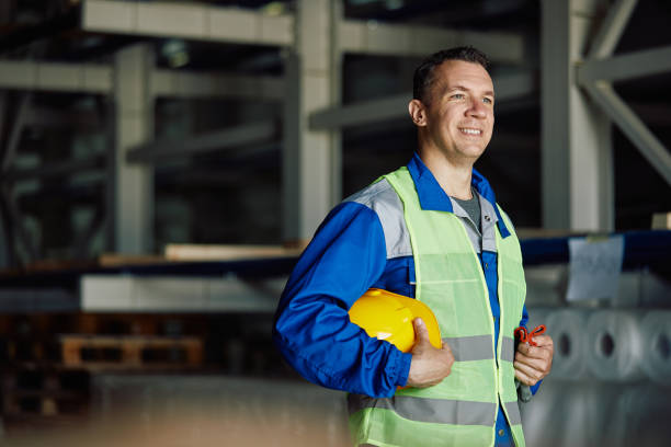 istock Portrait of happy warehouse worker looking away. 1406766540