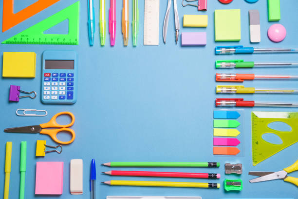 istock School objects, office supplies, tools and accessories isolated on blue 1406766610