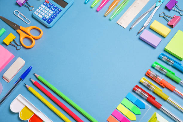 istock School objects, office supplies, tools and accessories isolated on blue 1406766632