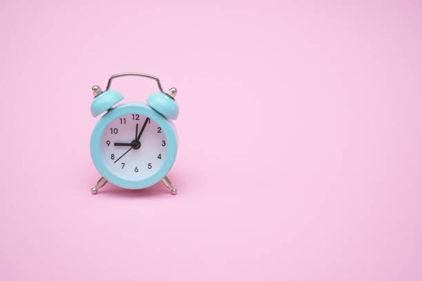 istock Blue alarm clock on a pink background. Copy space. Close-up. Deadline concept. 1406766689