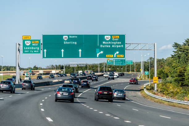 Sully road 28 multiple lane highway road in Northern Virginia with traffic cars and exit sign for Washington Dulles airport stock photo