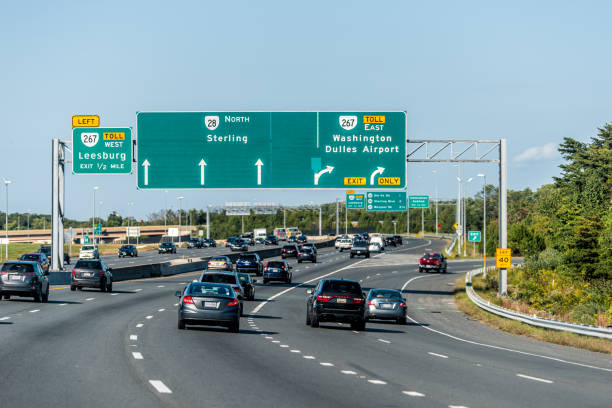 Sully road 28 multiple lane highway road in Northern Virginia with traffic cars and exit sign for Washington Dulles airport Herndon, USA - October 7, 2020: Sully road 28 multiple lane highway road in Northern Virginia with traffic cars and exit sign for Washington Dulles airport west marin stock pictures, royalty-free photos & images