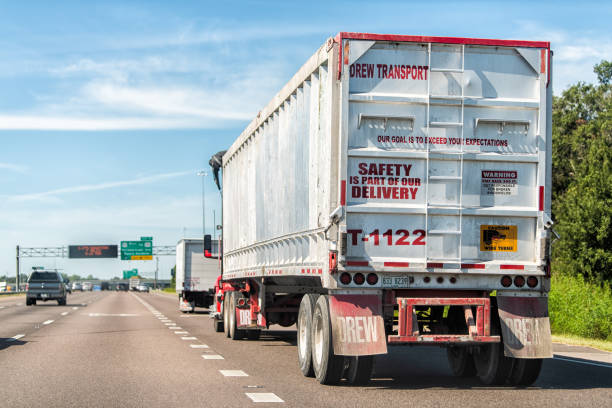Highway road i75 in Florida with truck vehicle for Drew transportation and sign on back for safety is part of our delivery in traffic stock photo