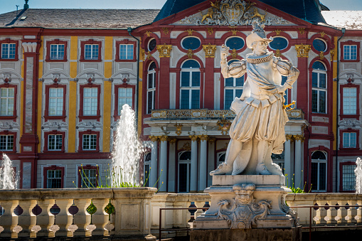 Ettal, Germany-June 11, 2016: Linderhof palace and fountain in garden, one of palace that King Ludwig II owned and finished when he was alive. Photo was shot on raining cloudy day.