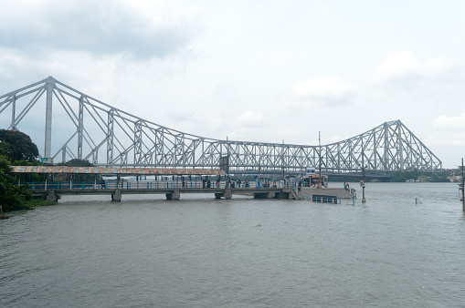 The Howrah Bridge, a balanced attached cantilever bridge covering over the Hooghly River in West Bengal, India, South Asia Pacific June 28, 2022