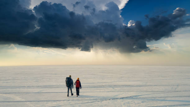 istock The two backpackers walking through the icy snow field 1406770138