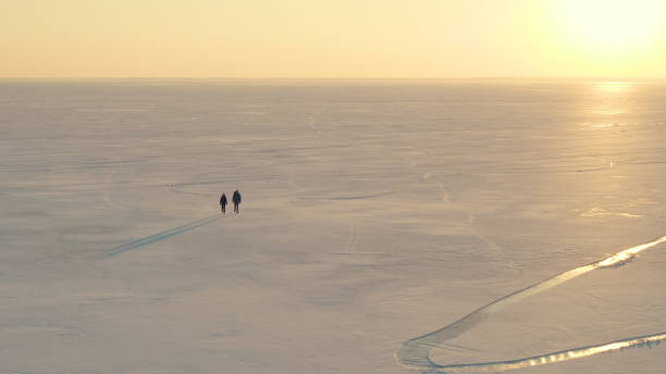 istock The beautiful view on the snow field and walking expeditors 1406770141