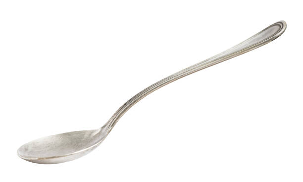 Silver Spoon Silver Spoon Isolated on White Background baby spoon stock pictures, royalty-free photos & images