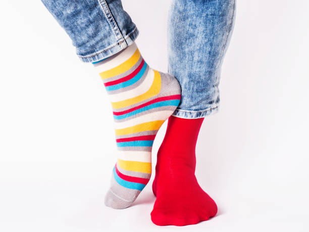 istock Men's legs and bright socks. Without shoes 1406777760