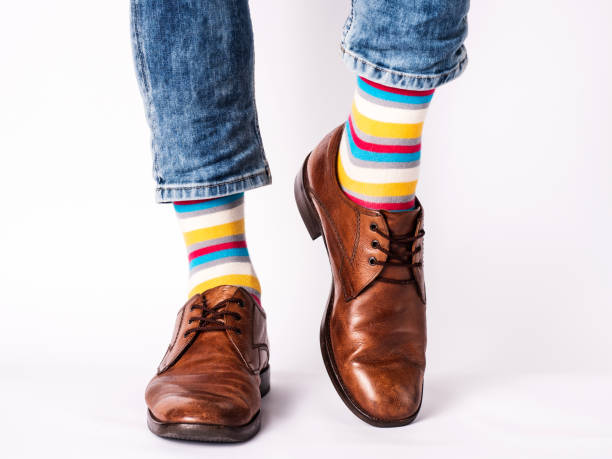 istock Men's legs, trendy shoes and bright socks 1406777785
