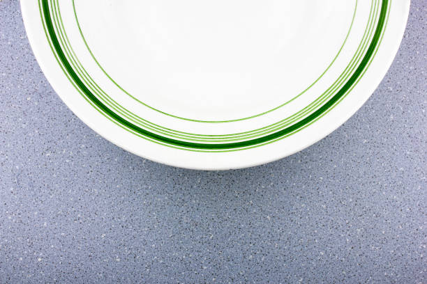 The Old porcelain plate.Old antique plate with green pattern ornament..