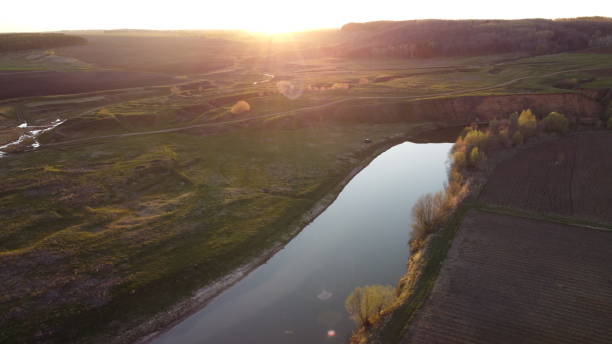 istock field sunset greenery river aerial view drone 1406781557