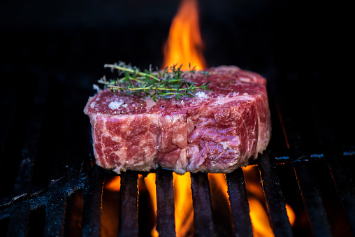 Beef Rib Eye Steak on a Hot Grill