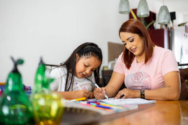 istock Mom and daughter coloring 1406782905