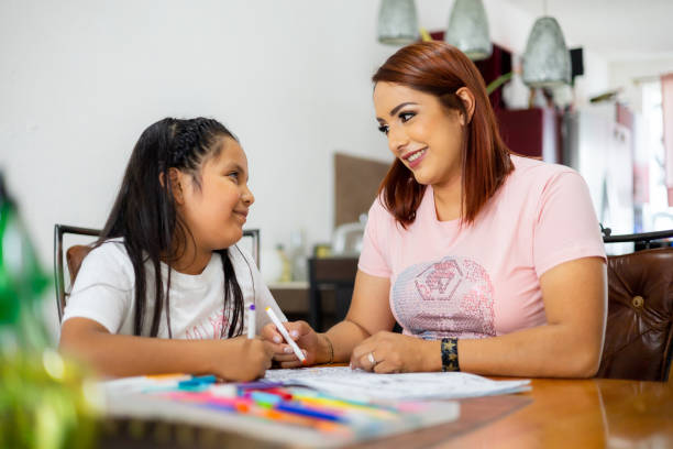 istock Mom and daughter coloring 1406782942