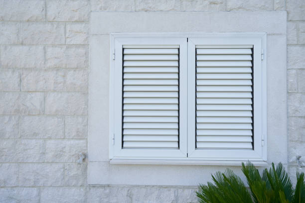 istock Plastic external window shutters on a residential building 1406784516
