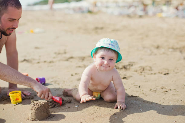 istock Father and son on the beach 1406784957