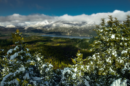 Scenic view from beatiful lakes and snowed mountains in Bariloche, Patagonia, Argentina. This destination is very popular among south and north americans and also for europeans.