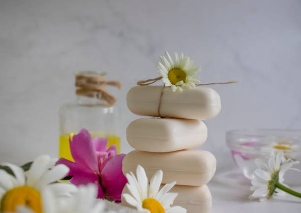 istock Soap cosmetic flower chamomile, peony on a light background 1406785823