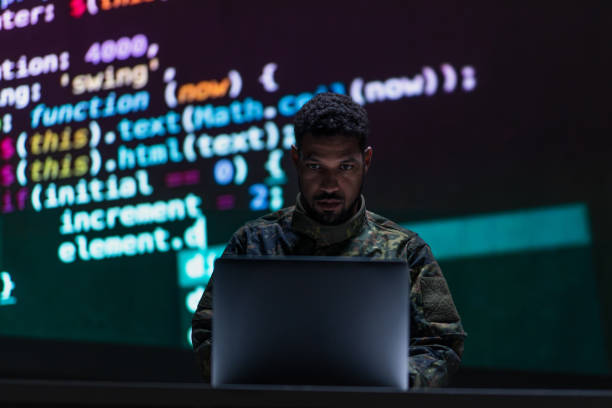 istock Hacker in military unifrorm on dark web, cyberwar concept. 1406786202