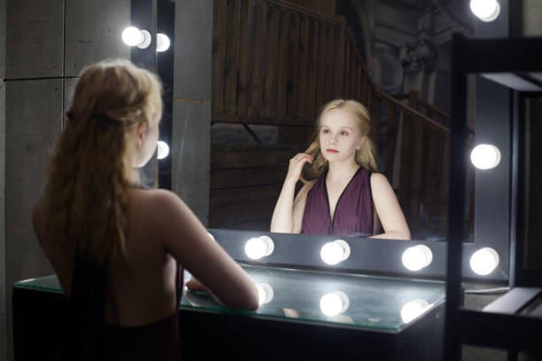 young beautiful woman with makeup and reflection in dressing room - mirror women reflection ghost imagens e fotografias de stock