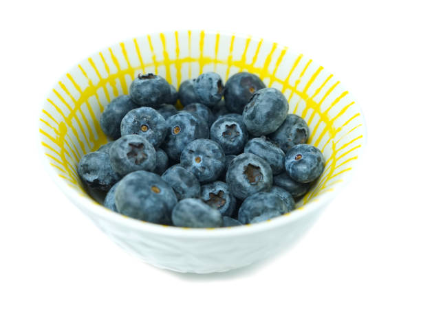 istock Blueberries in bowl white background 1406788815