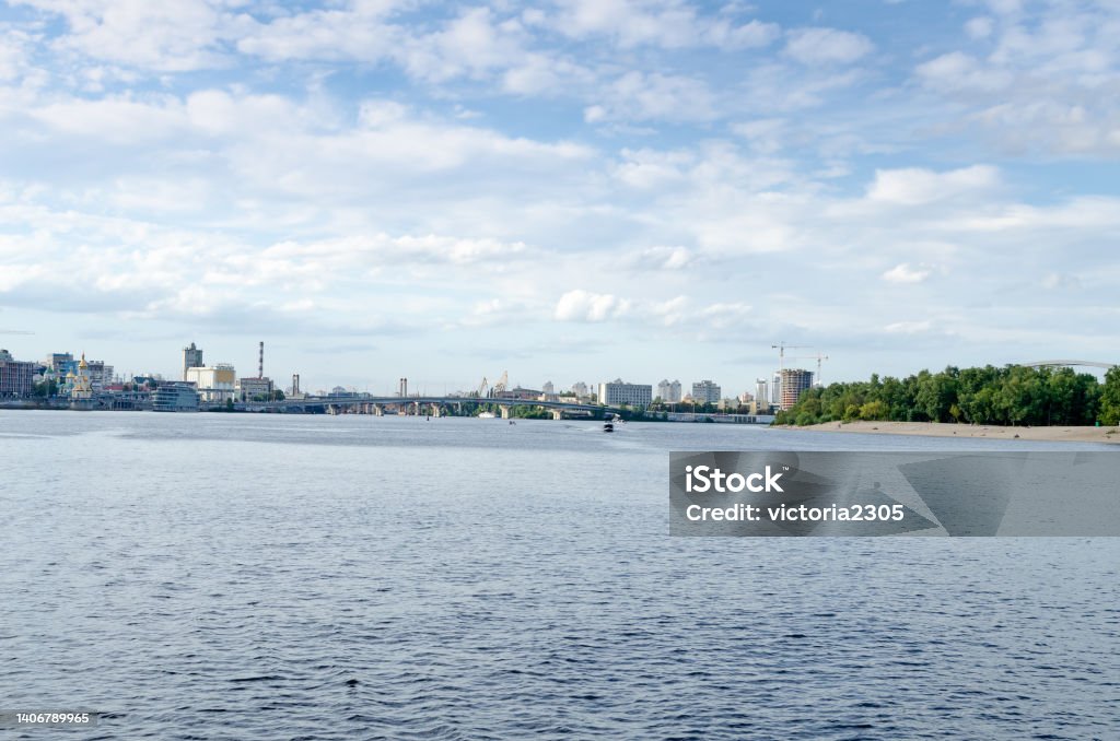 beautiful summer cityscape view of the city of Kyiv, the capital of Ukraine, from the Dnipro river to the city, the railway station and Trukhanov island, with a beautiful blue sky Architecture Stock Photo