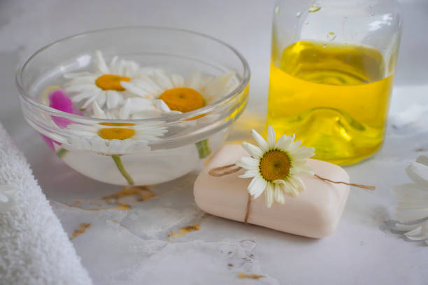 istock Soap cosmetic flower chamomile, peony on a light background 1406791515