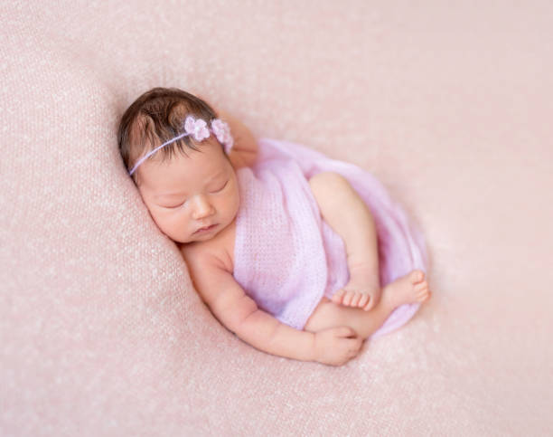 istock sleeping newborn baby girl 1406792955