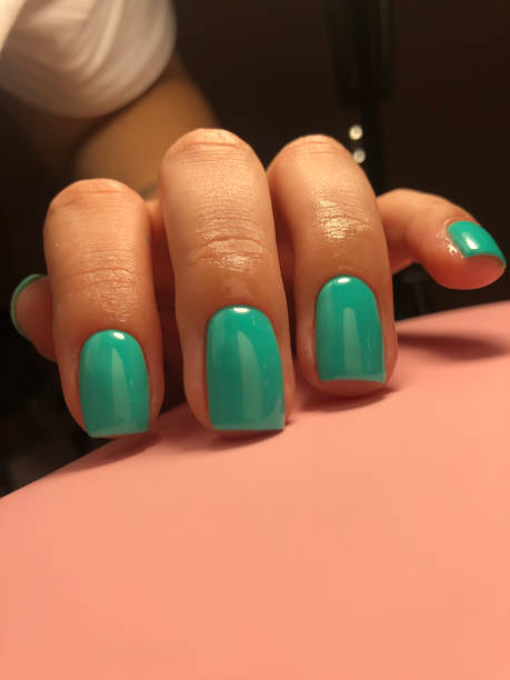 istock Fingers with lilac manicure. Selective focus. 1406793803