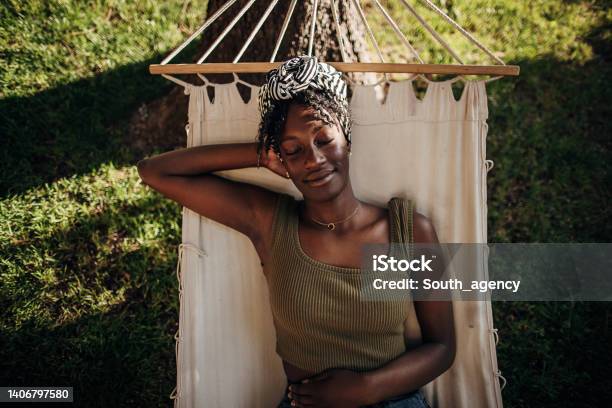 Woman Relaxing In A Hammock Stock Photo - Download Image Now - Relaxation, Hammock, Women