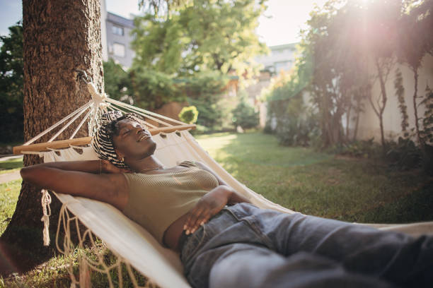 istock Woman relaxing in a hammock 1406797586