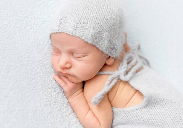 istock Tender newborn sleeping on belly 1406797660